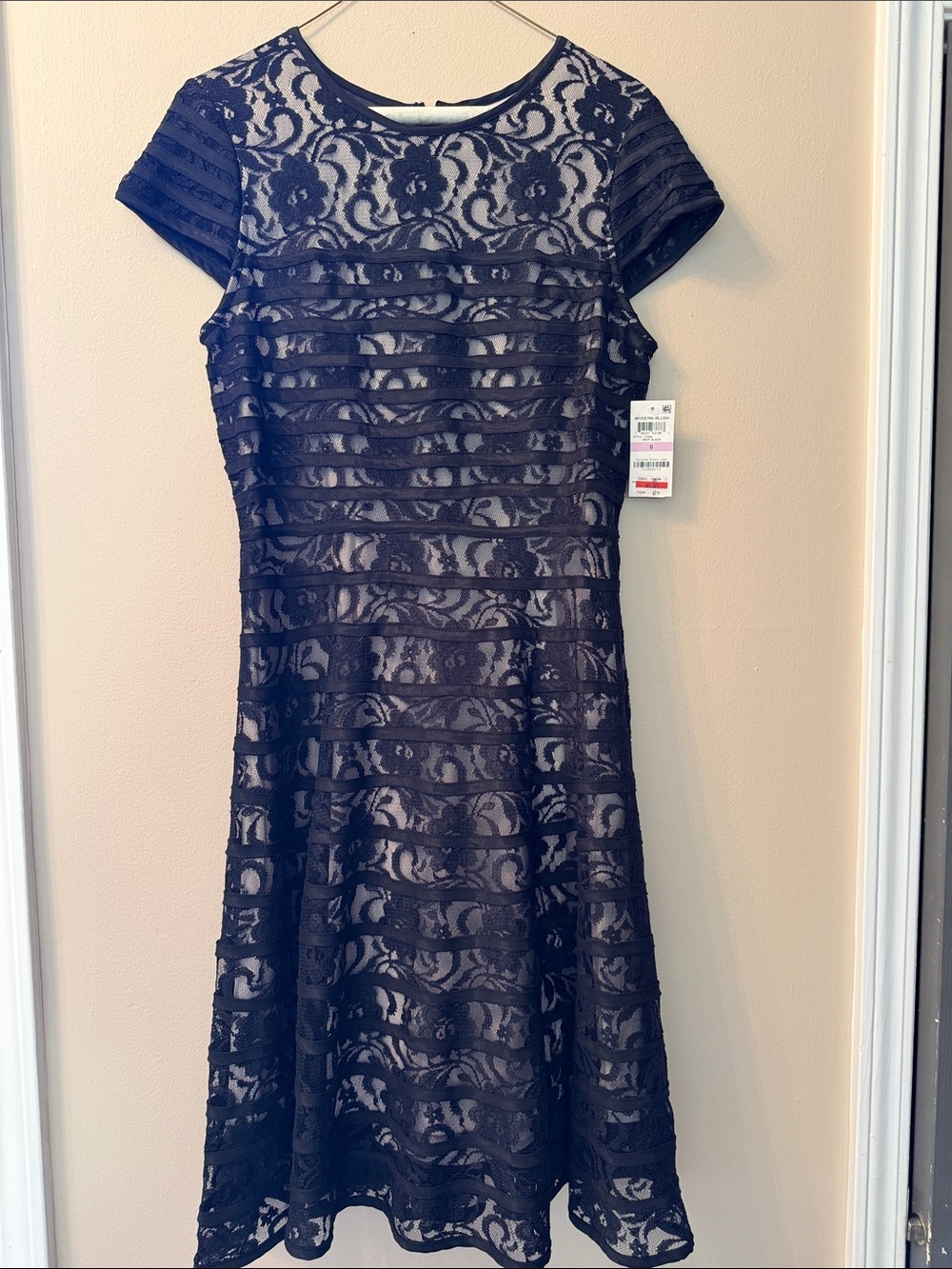 Alfani lace lined dress black and lining is white.
